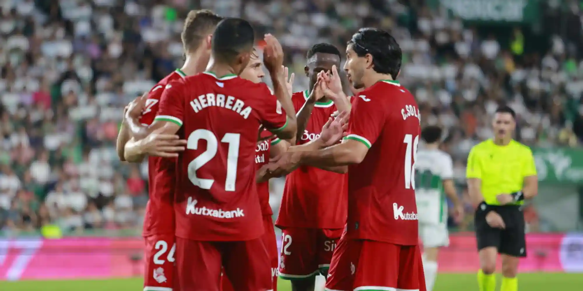 Real Sociedad players congratulate one another after scoring against Elche