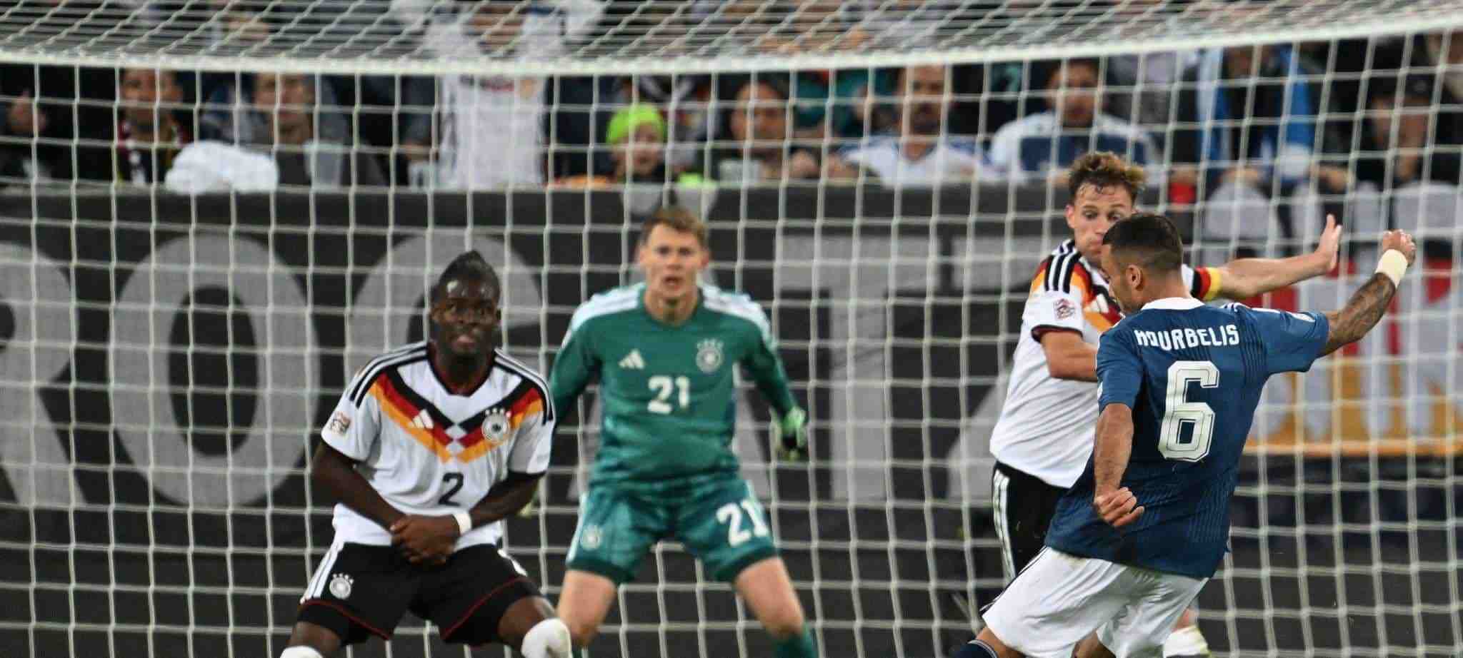 Dimitrios Kourbelis shoots towards Germany's goal