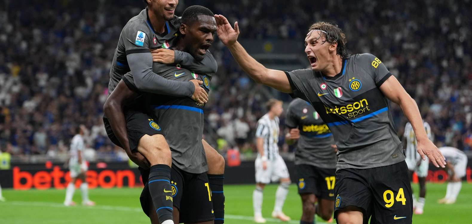 Inter players celebrate after scoring against Udinese