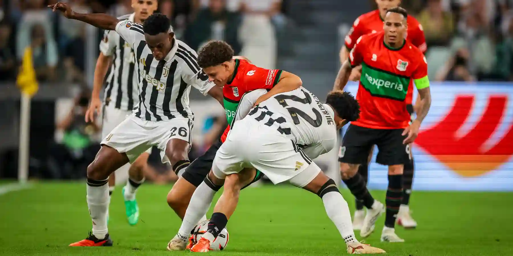 Juventus and NEC players in a battle for the ball