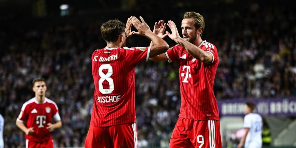 Harry Kane and Tom Bischof congratulate one another