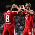 Harry Kane and Tom Bischof congratulate one another