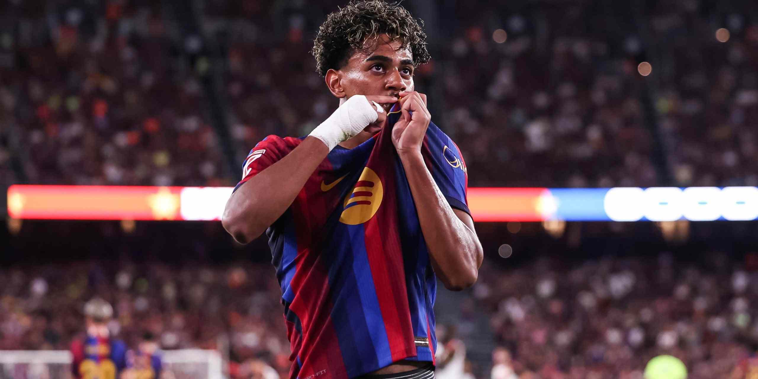 Lamine Yamal kisses Barcelona's badge after scoring against Rayo Vallecano