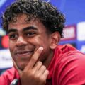 Lamine Yamal smiling during a press conference