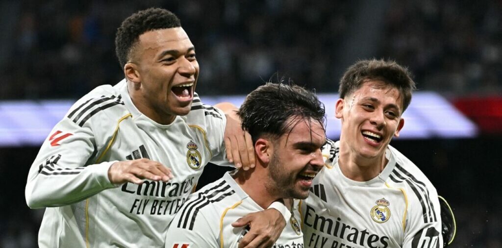 Real Madrid players celebrate after scoring a goal