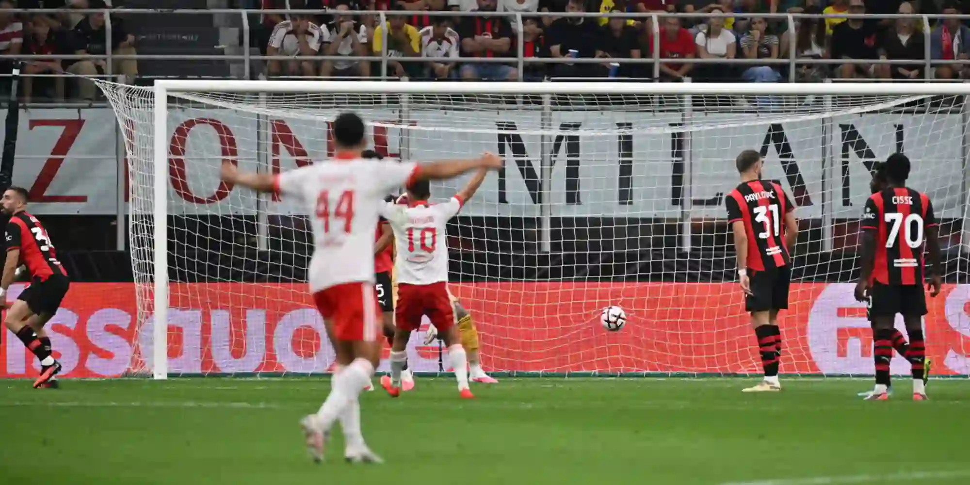Benfica scoring in Milan's net