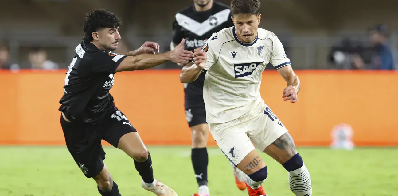 OFI and Hoffenheim players in a battle for the ball