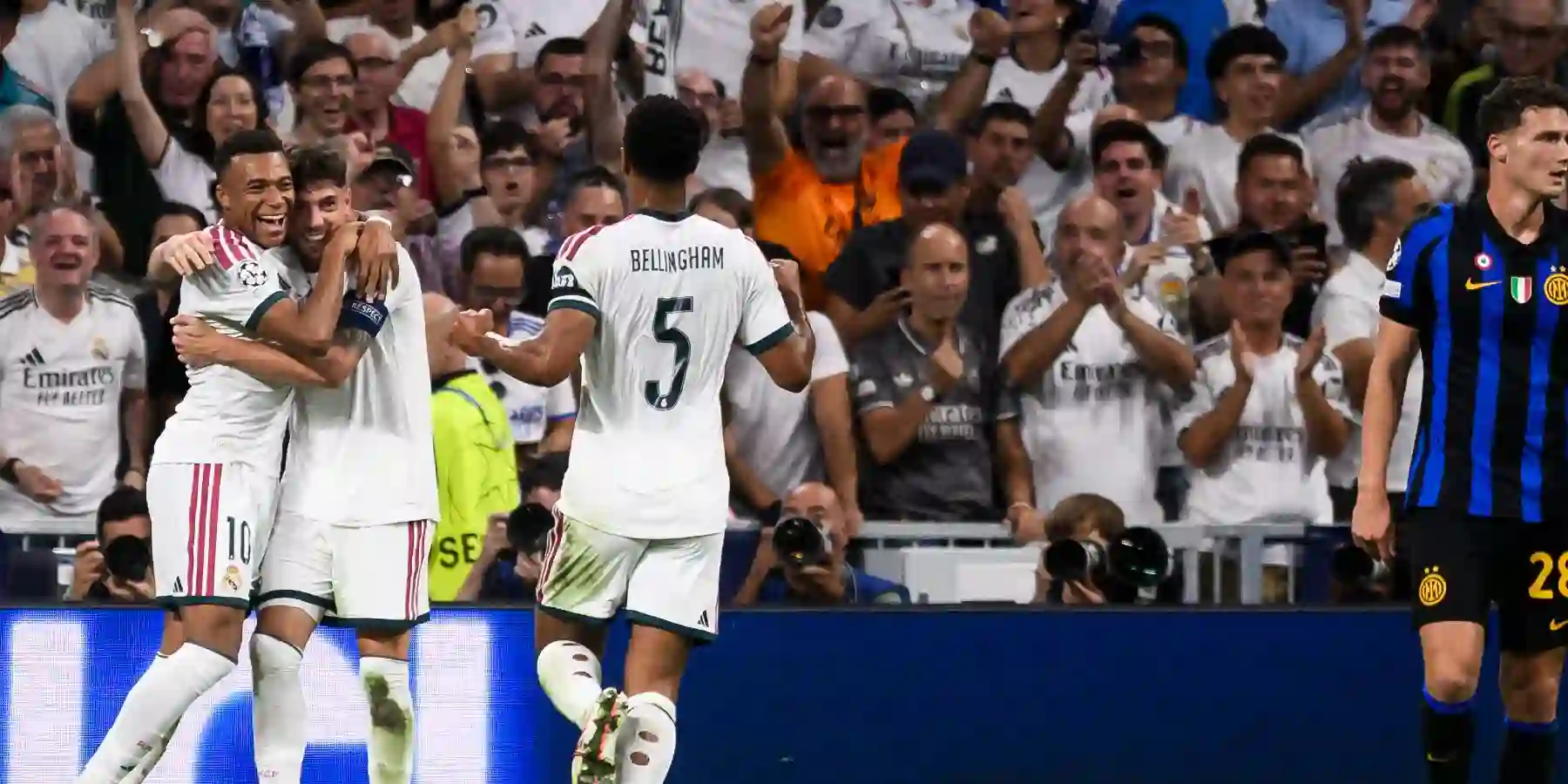 Real Madrid players celebrate after scoring against Inter