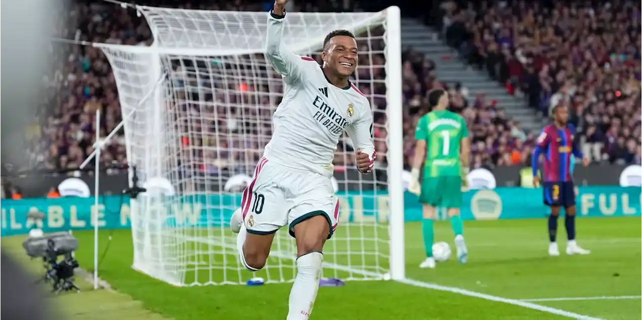 Kylian Mbappe celebrates after scoring against Barcelona