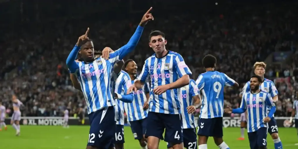 Coventry City players celebrate after scoring against Newcastle