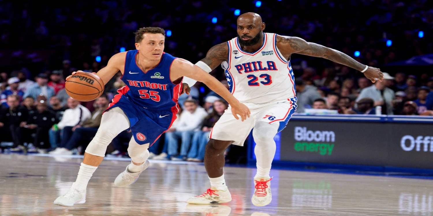 LeBron James watches as Duncan Robinson dribbles past him
