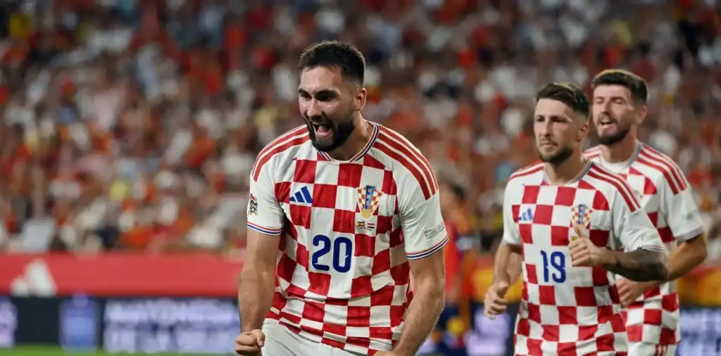 Dion Beljo celebrates after scoring his first goal for Croatia