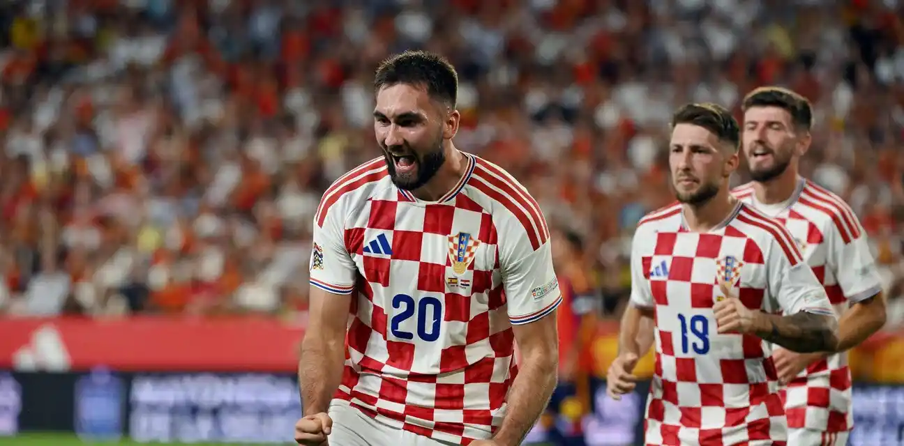Dion Beljo celebrates after scoring his first goal for Croatia