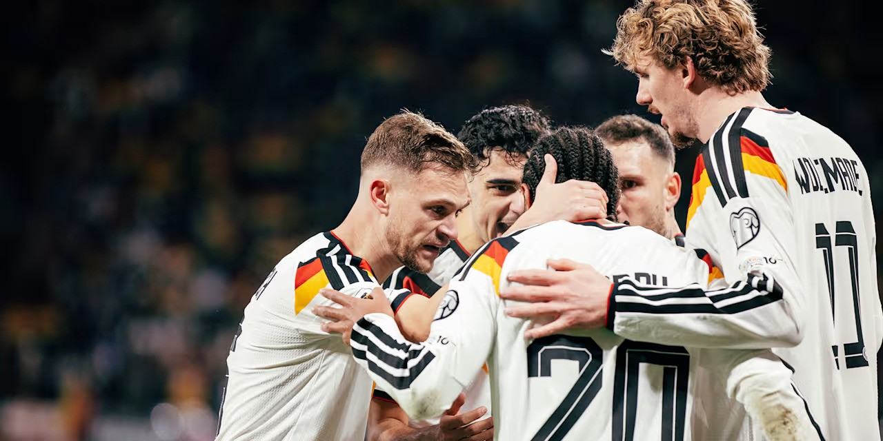 German players celebrate after scoring against Serbia