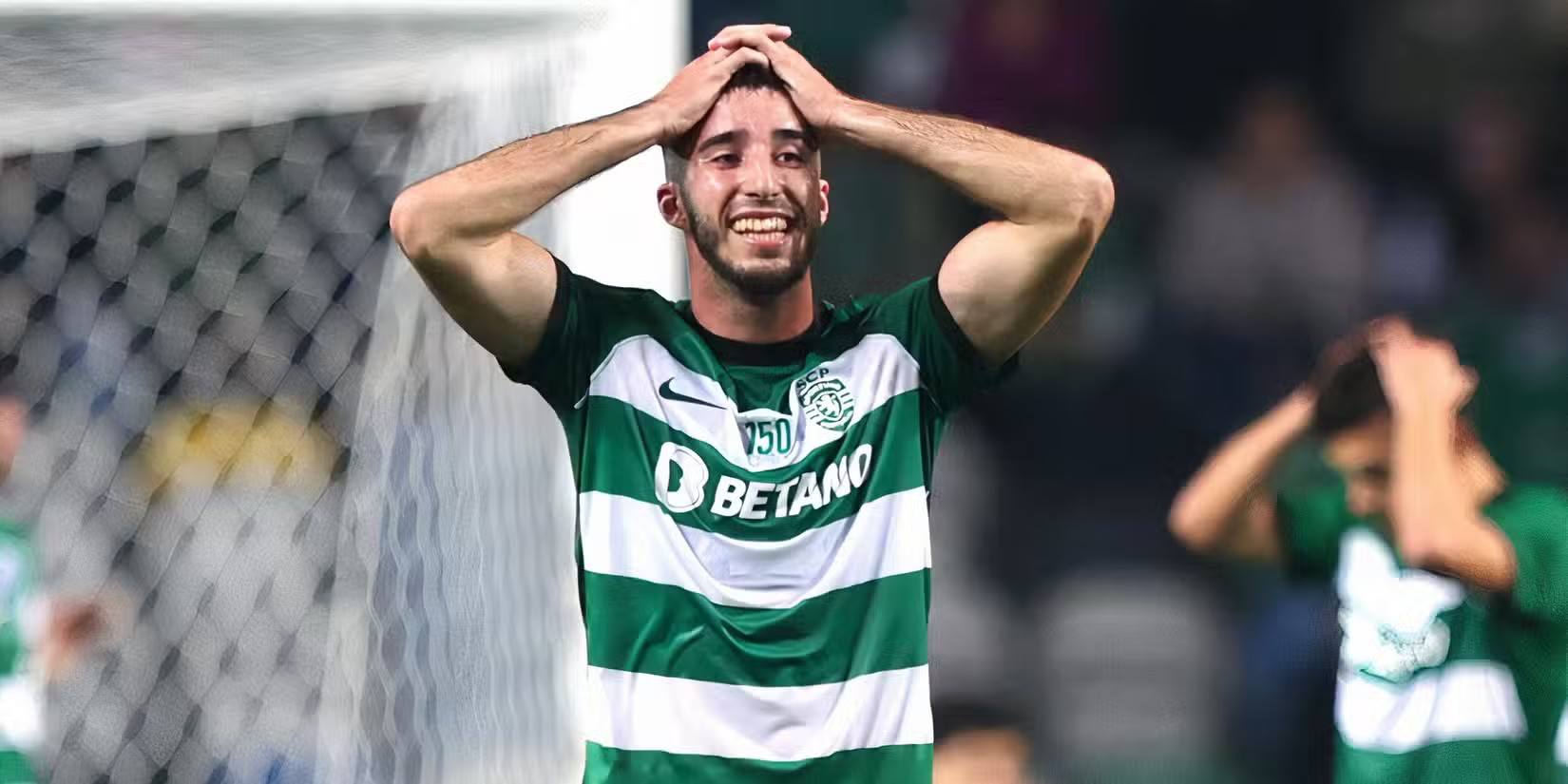 Sporting defender Goncalo Inacio holding his head