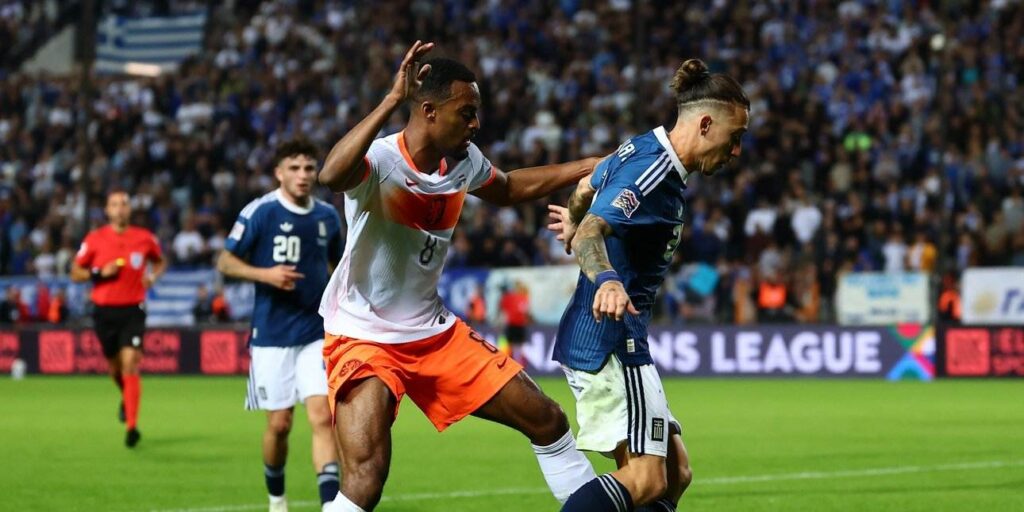 Greek and Dutch players in a battle for the ball