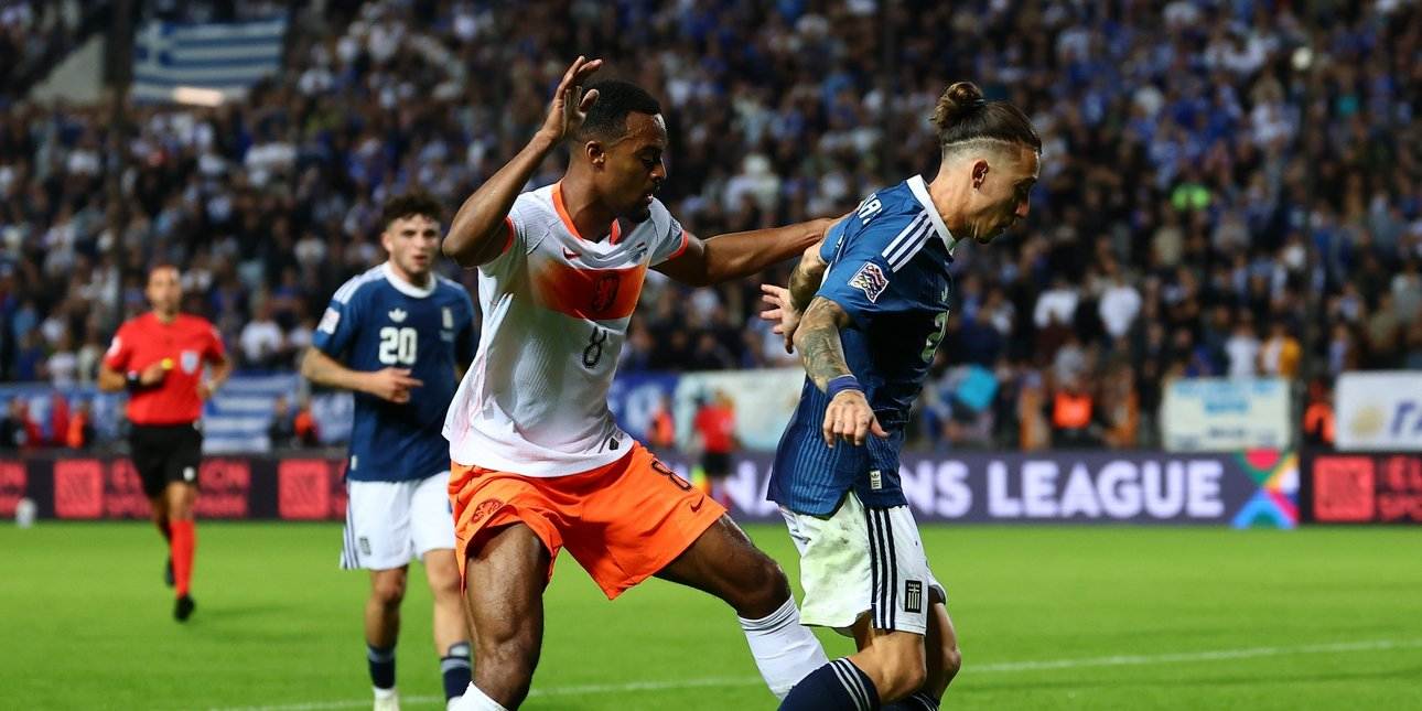 Greek and Dutch players in a battle for the ball