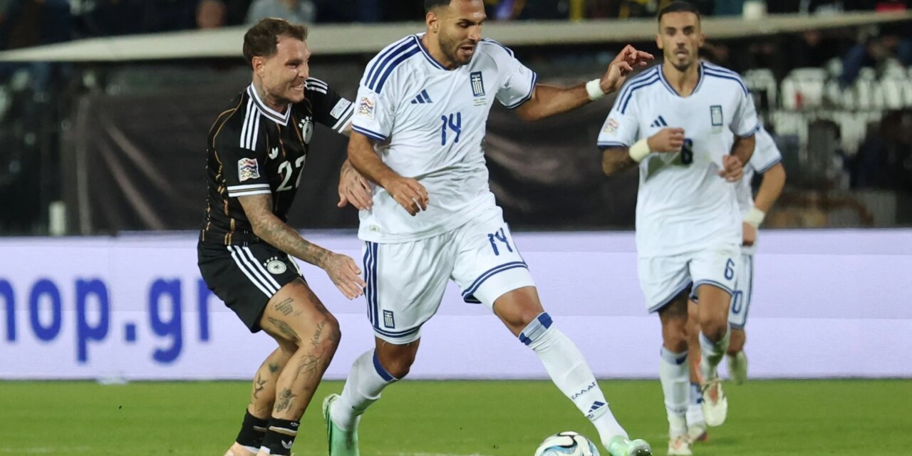 Germany and Greece players in a battle for the ball