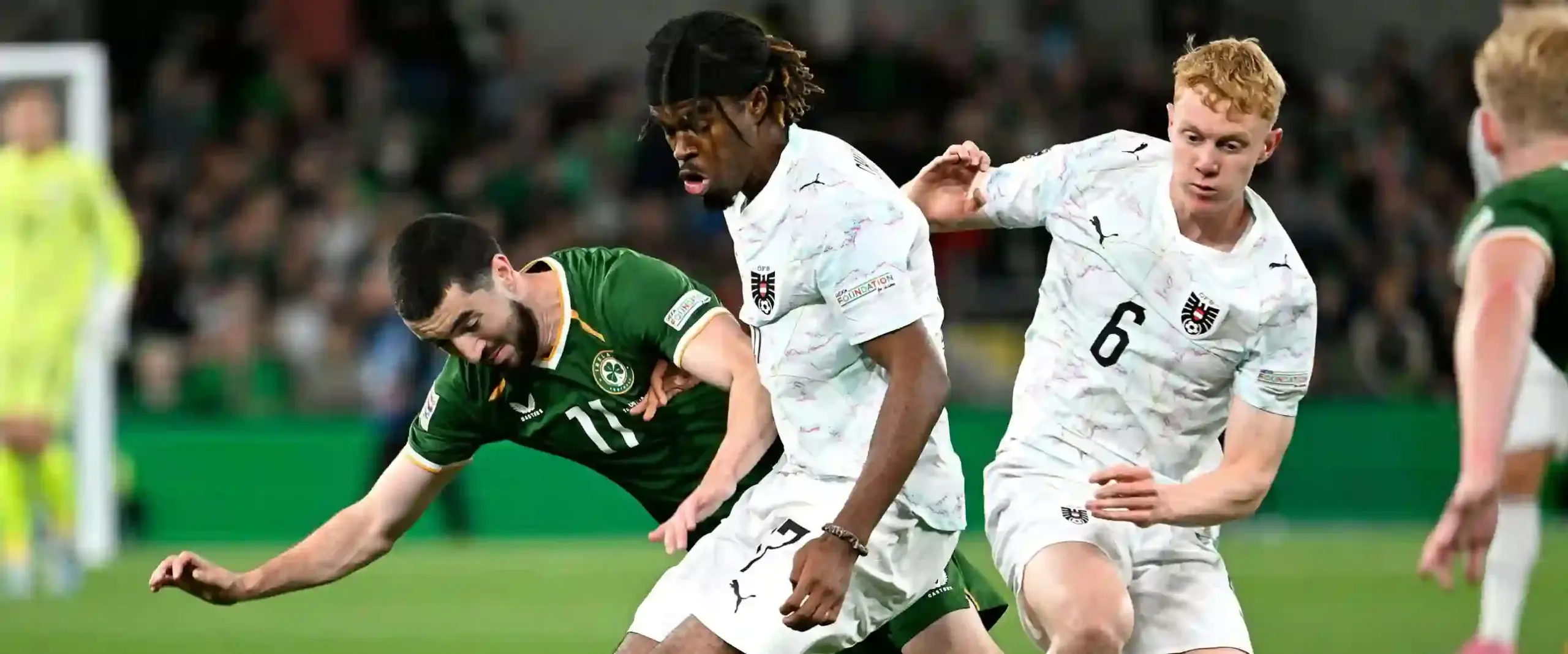 Irish and Austrian players in a battle for the ball