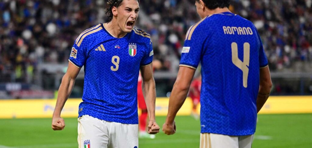 Italy players celebrate after scoring