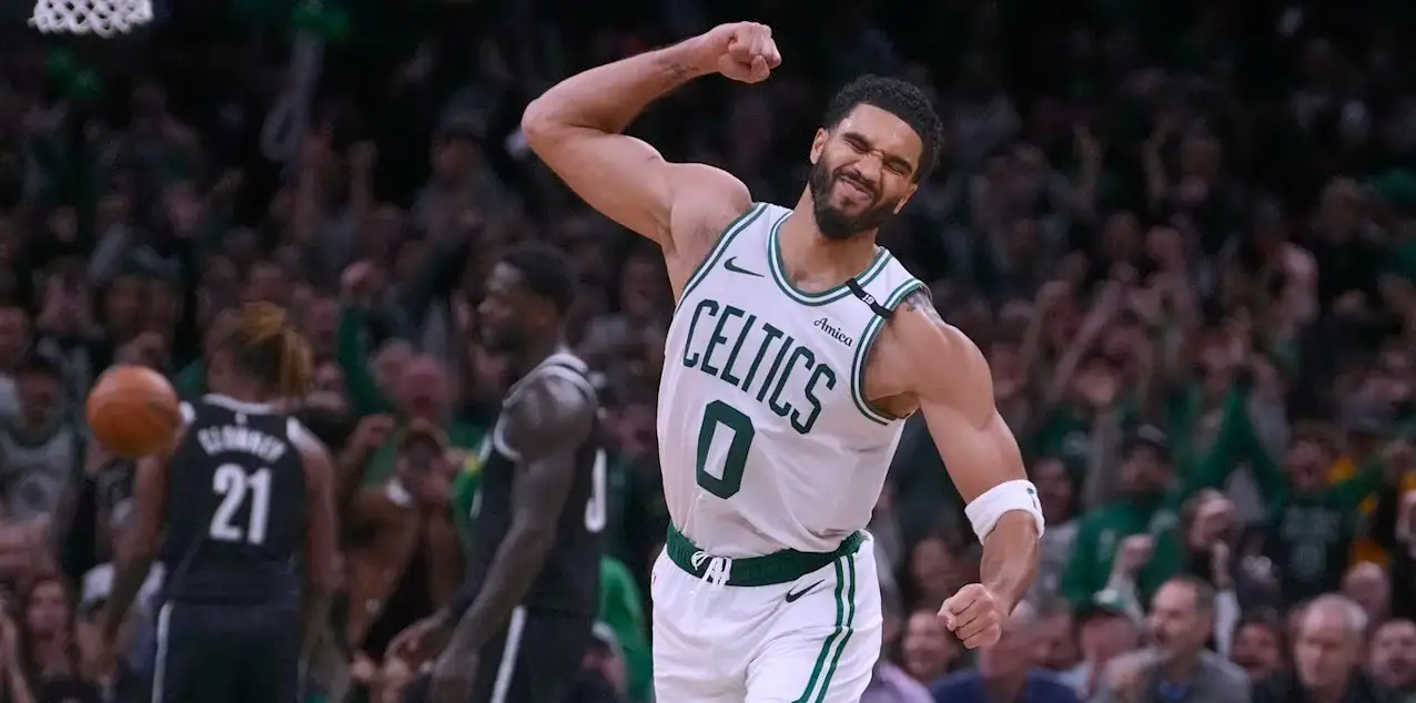 Jayson Tatum punches the air after scoring the game winning basket against the Brooklyn Nets