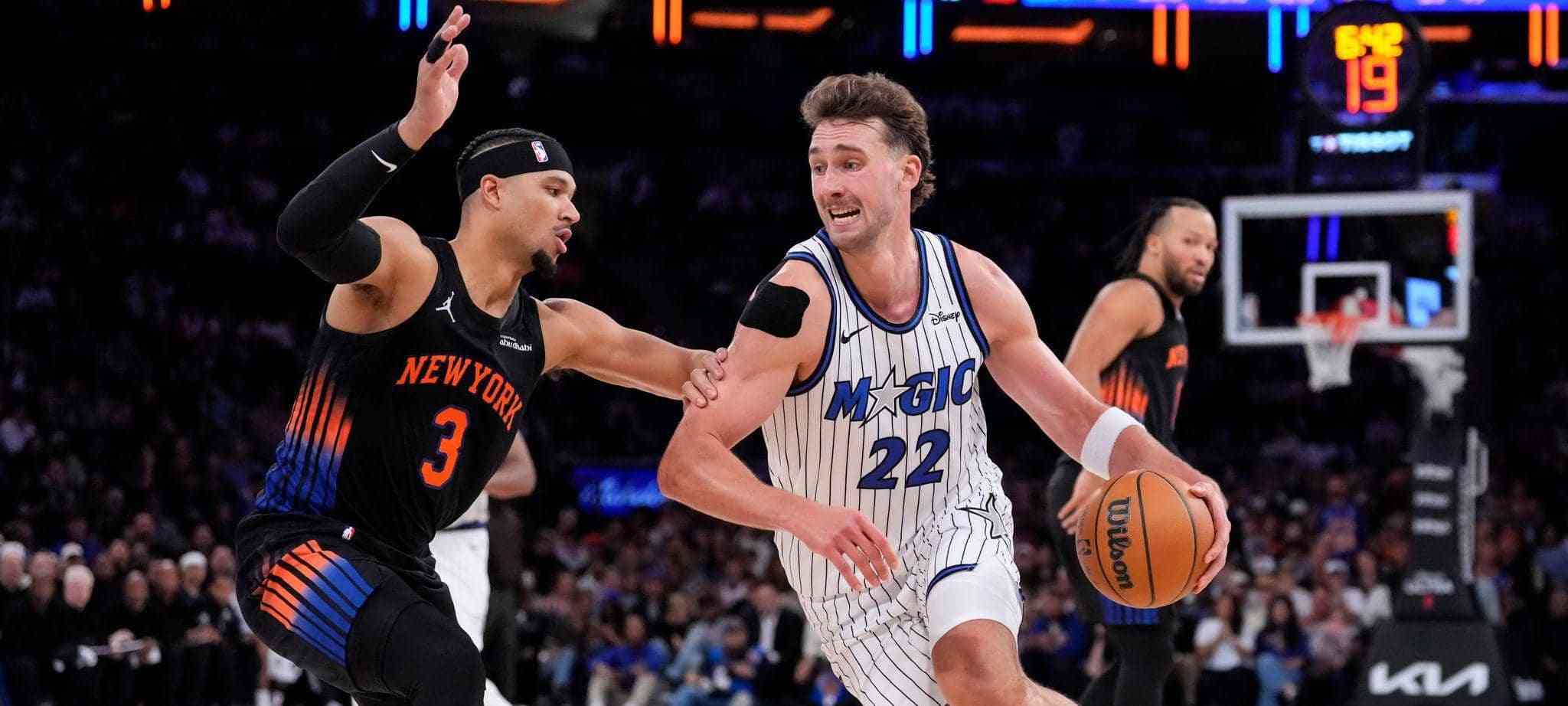 Franz Wagner trying to dribble past Josh Hart