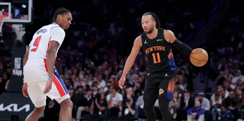 Ausar Thompson watches as Jalen Brunson dribbles the ball