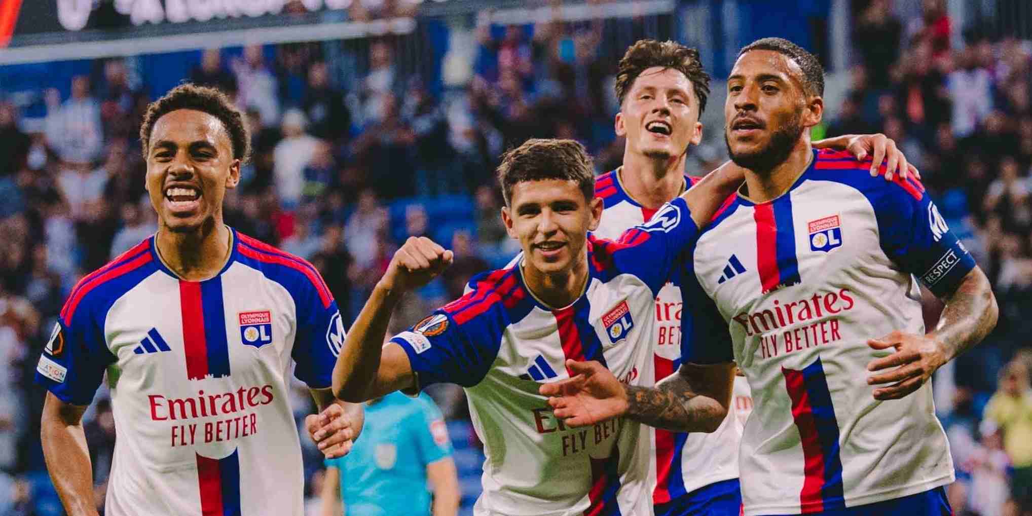 Lyon players celebrate after scoring against Crystal Palace