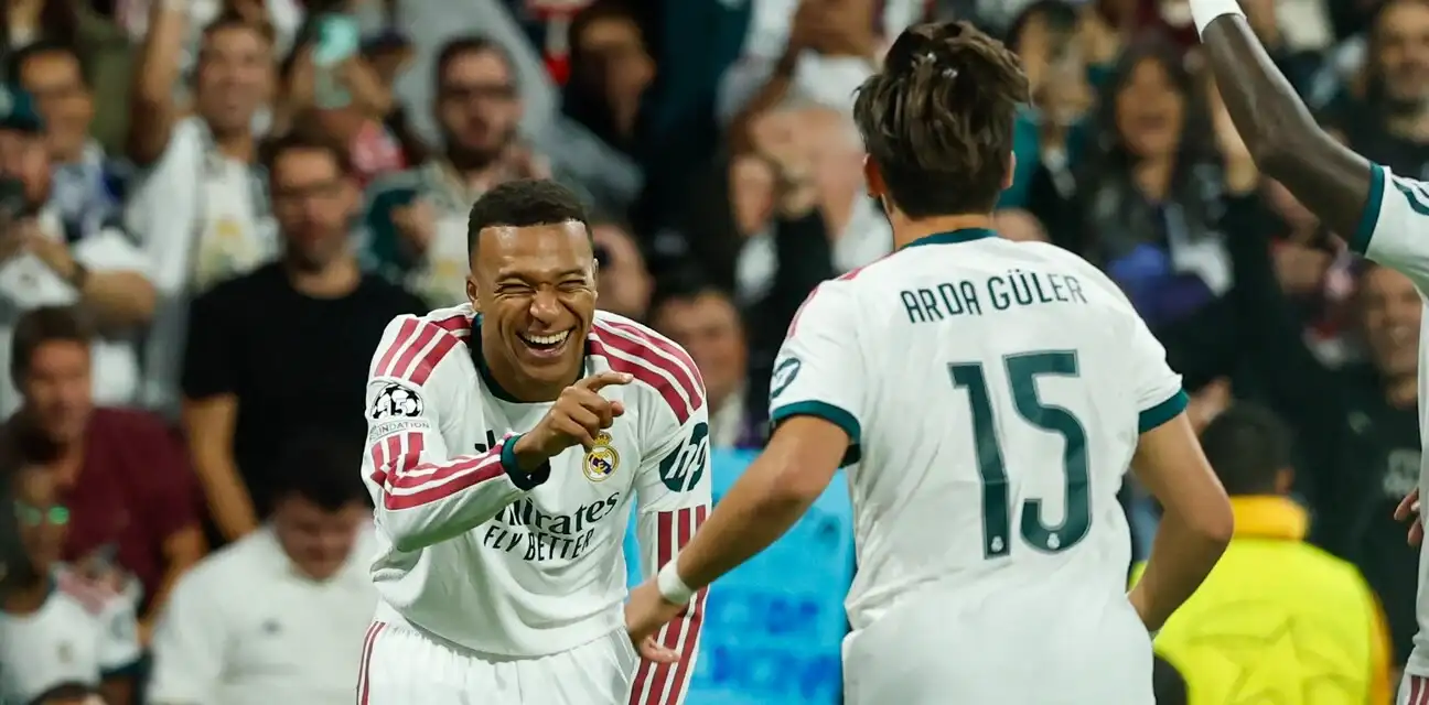 Kylian Mbappe and Arda Guler celebrate after Real Madrid have scored against RB Leipzig