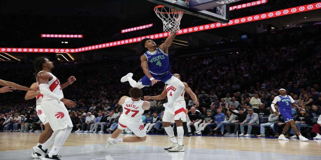 Terrence Shannon Jr. dunking the ball in Toronto's basket