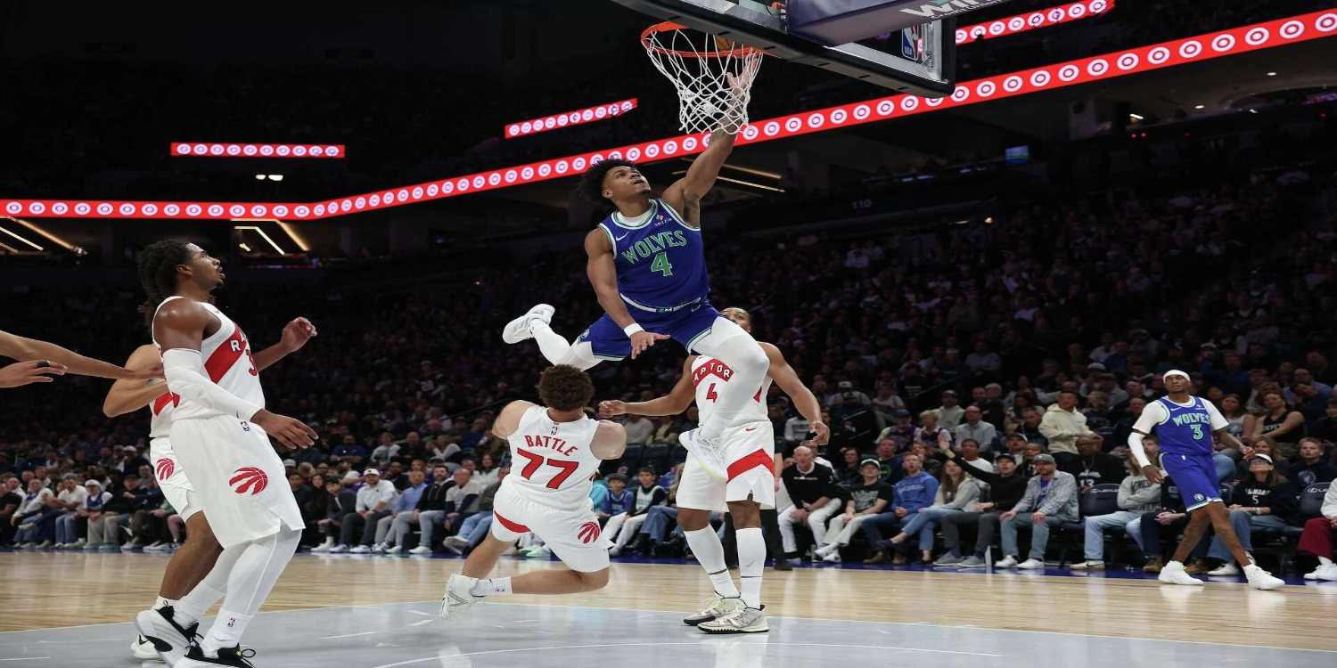 Terrence Shannon Jr. dunking the ball in Toronto's basket
