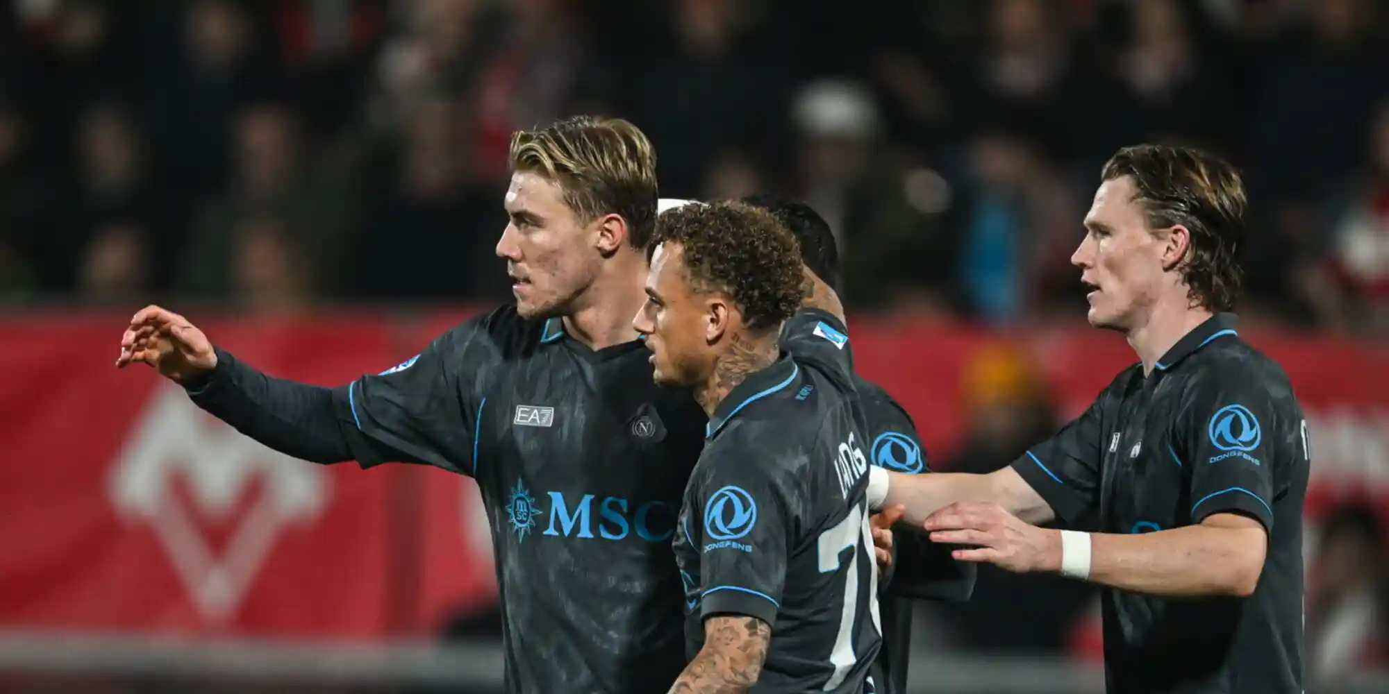 Napoli players congratulate one another after scoring against Monza