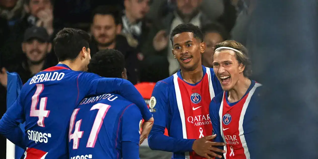 PSG players celebrate after scoring against Lyon