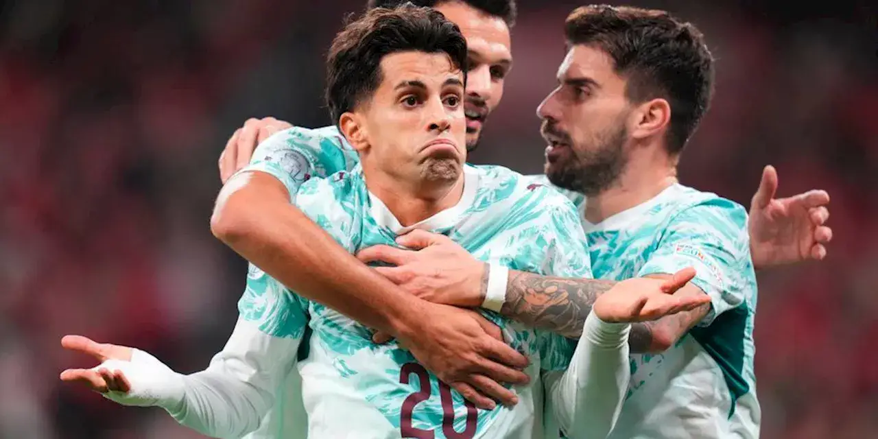 Joao Cancelo and his Portugal teammates celebrate after scoring again Denmark