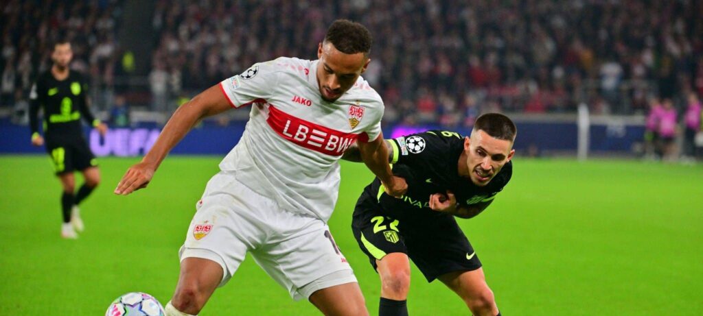 Stuttgart and Atletico Madrid players in a battle for the ball