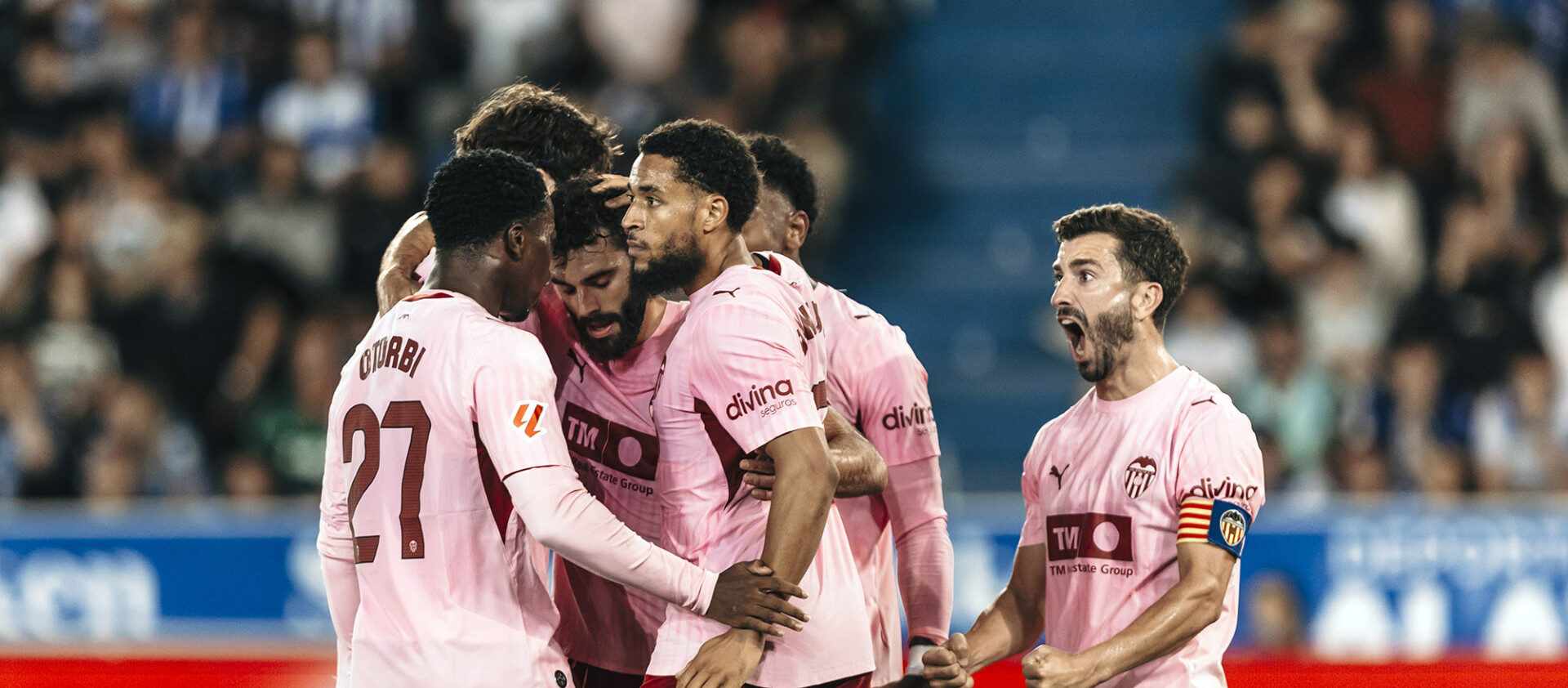 Valencia players celebrate after scoring a goal