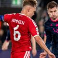 Viking player trying to block Joshua Kimmich from shooting