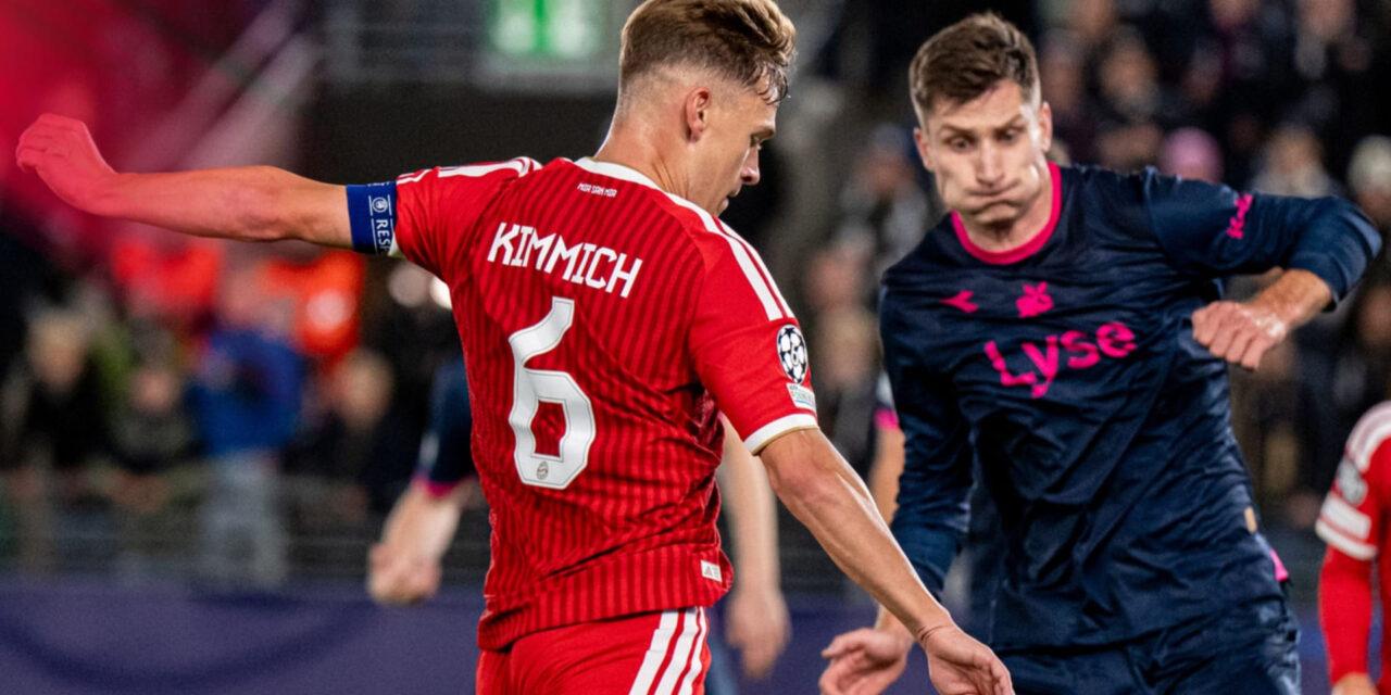 Viking player trying to block Joshua Kimmich from shooting